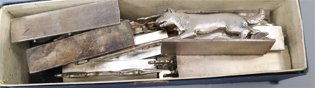 A set of twelve French Art Deco knife rests